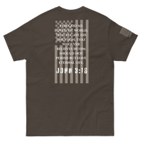 Faith Is EDC carry tee with American flag overlay and John 3:16 verse on back — patriotic design blending spiritual conviction and national pride.